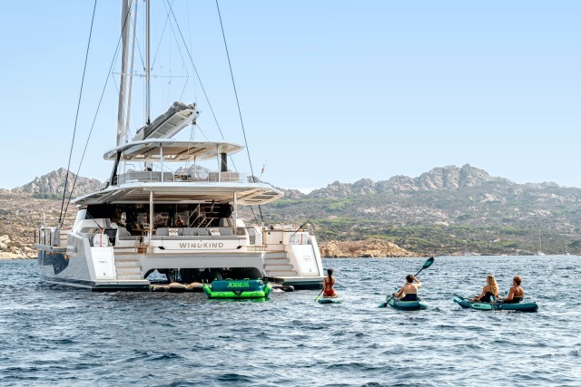 WINDKIND at anchor with kayaks and paddleboards